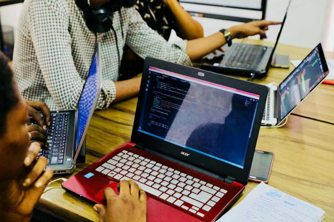 software developers coding together